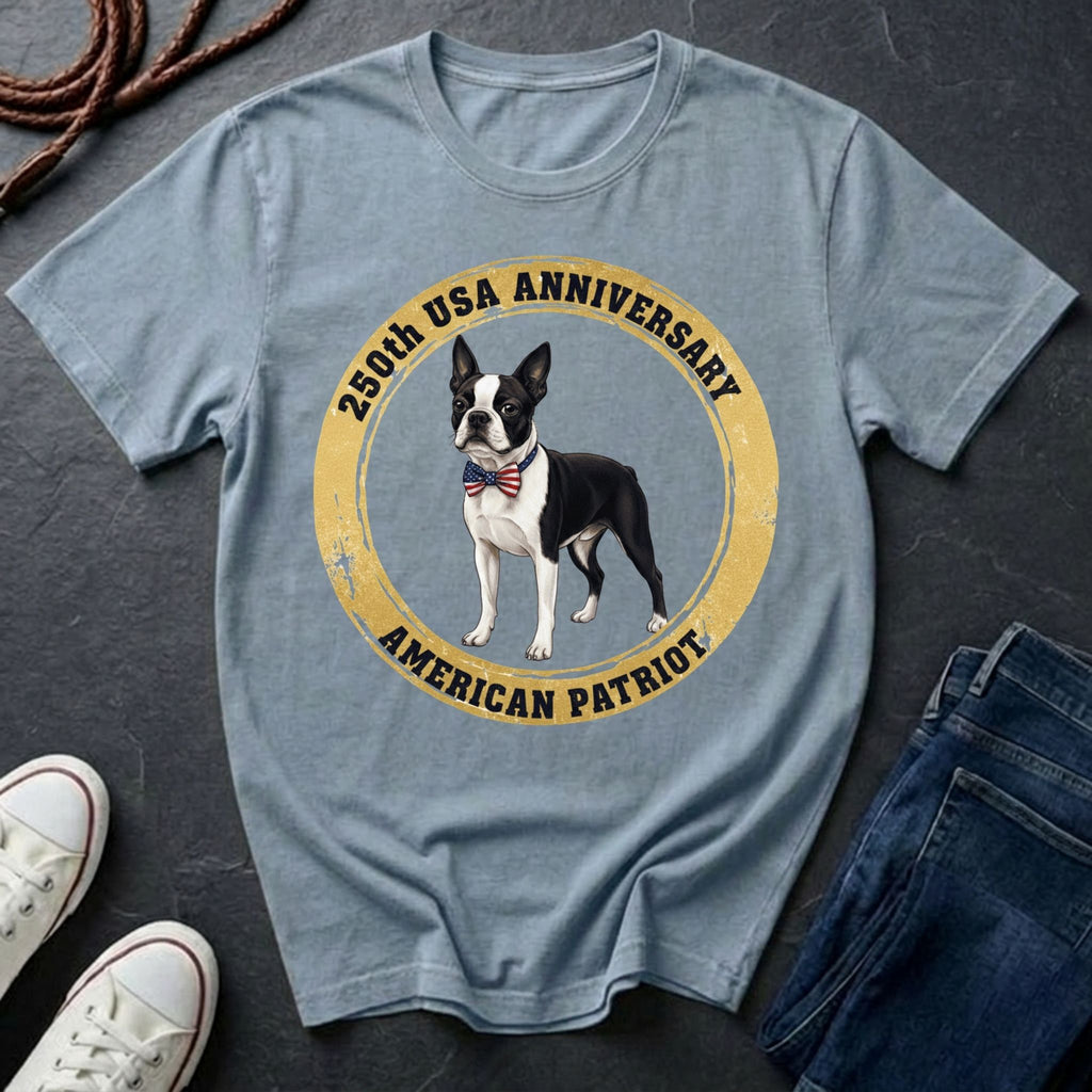 Blue Comfort Colors t-shirt with a dog graphic and text on a dark surface with shoes and jeans.