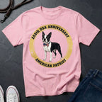Pink Comfort Colors t-shirt with a dog graphic and text on a dark surface