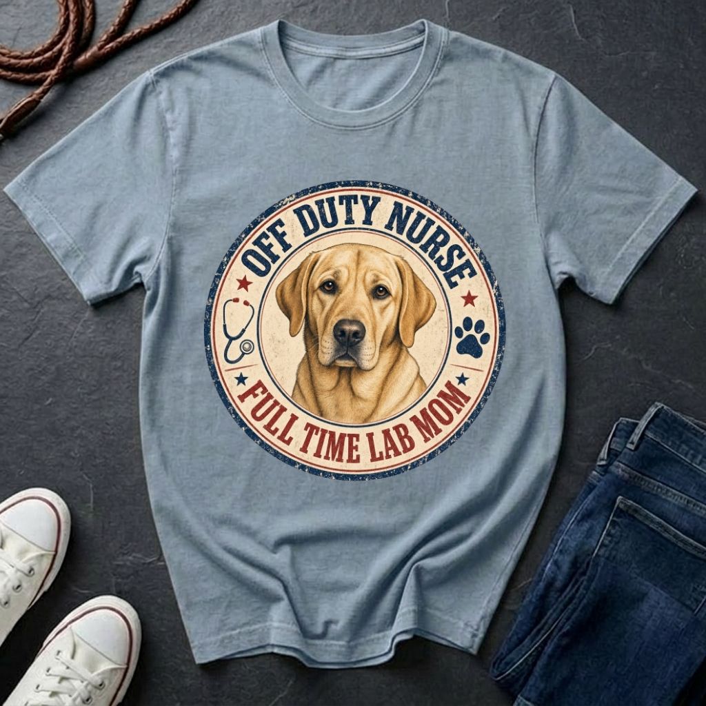 Blue Comfort Colors t-shirt with a dog graphic and text on a dark surface