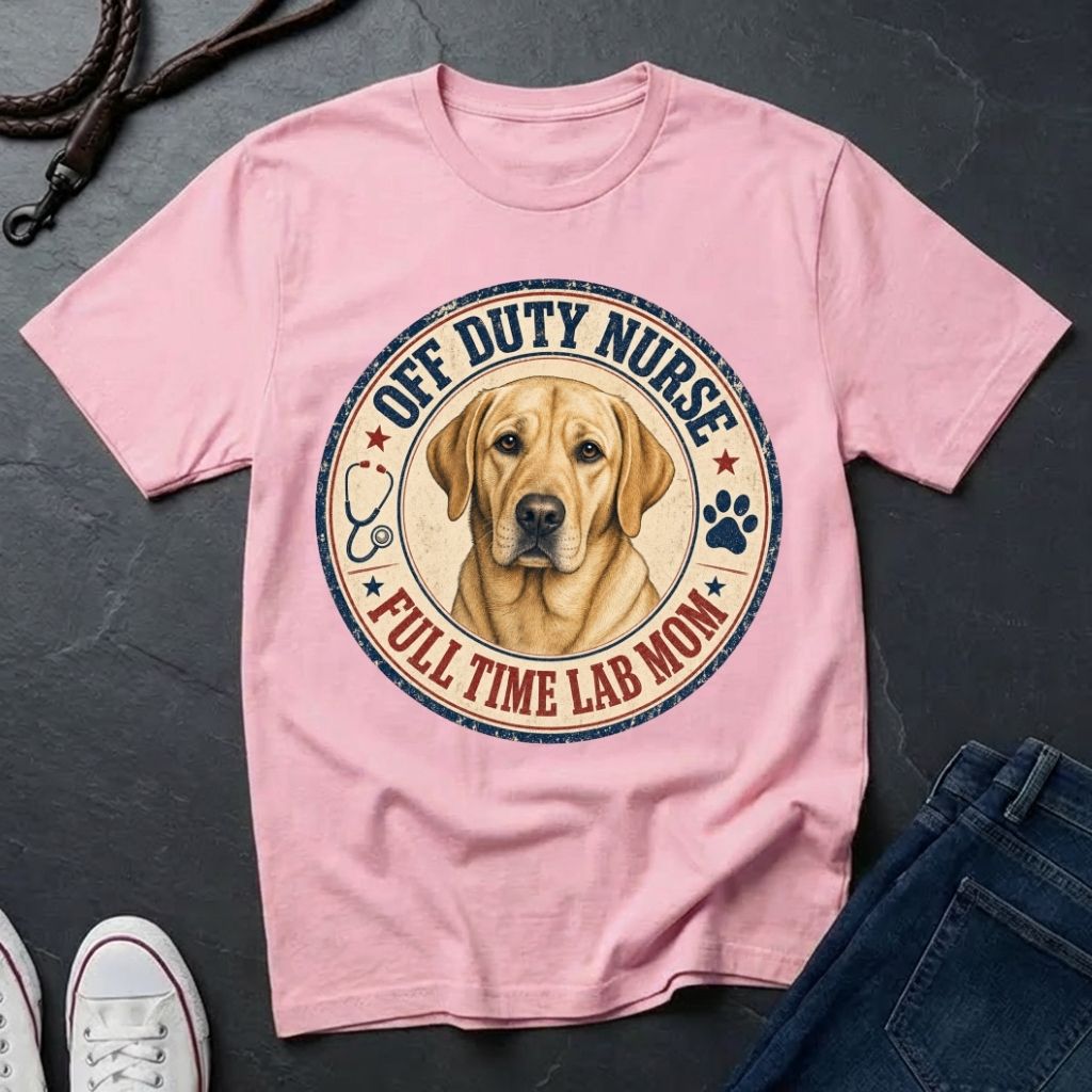Pink Comfort Colors t-shirt with a dog graphic and text on a dark surface