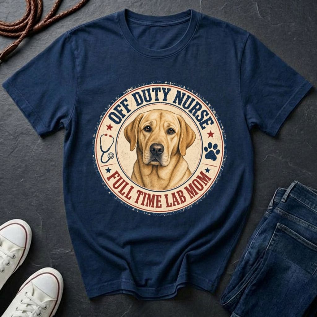 Navy blue Comfort Colors t-shirt with a dog graphic and text on a dark surface with shoes and jeans.