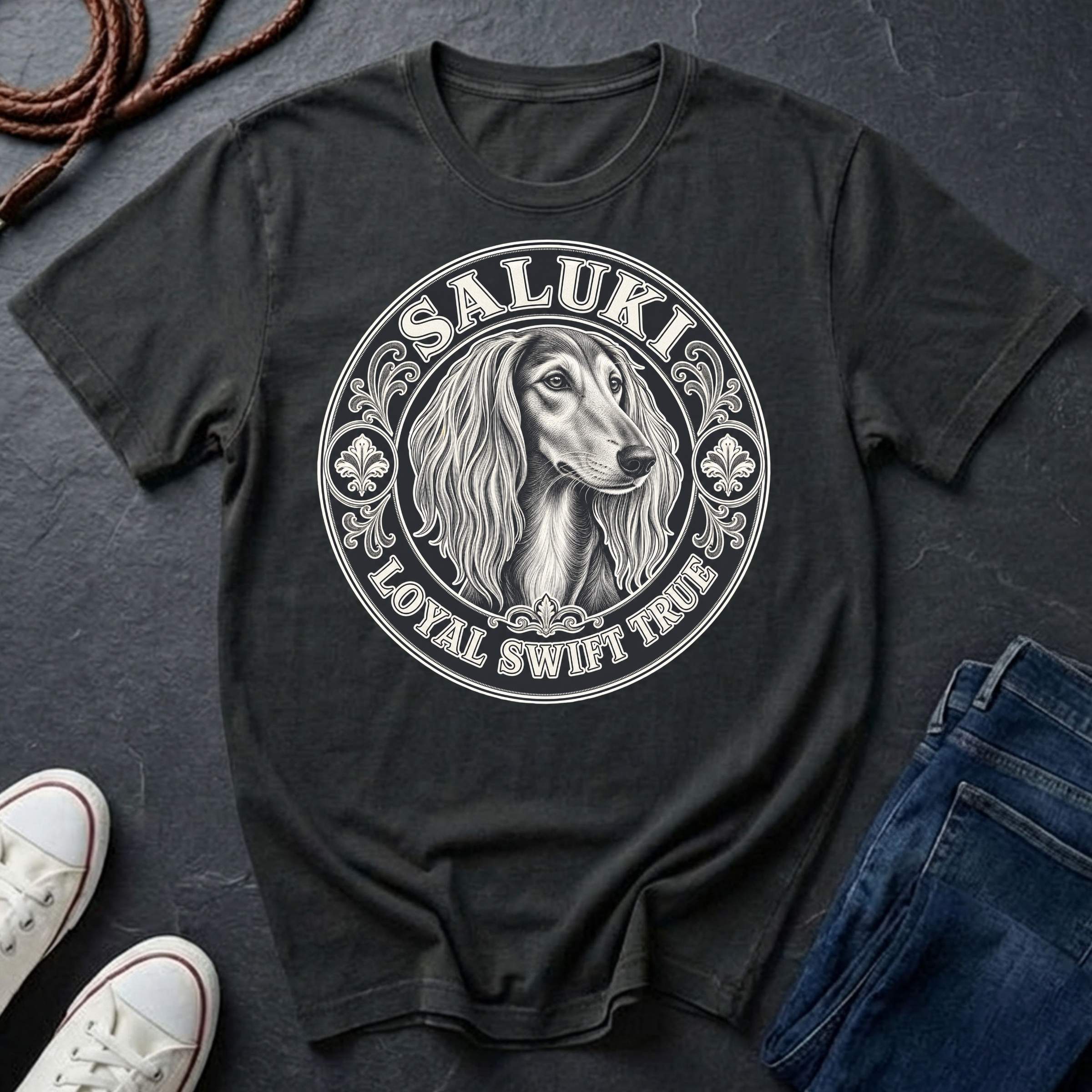Saluki Heritage Badge t-shirt design featuring vintage crest emblem with elegant sighthound portrait on a black Comfort Colors tee