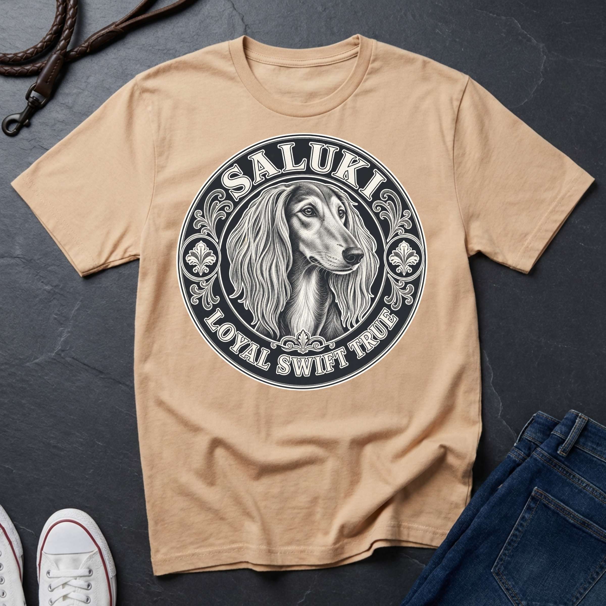 Saluki Heritage Badge t-shirt design featuring vintage crest emblem with elegant sighthound portrait on a ivory Comfort Colors tee