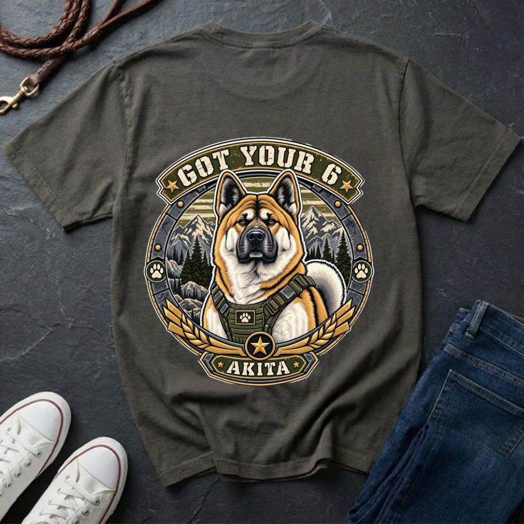 Akita Got Your 6 t-shirt design featuring a tactical distressed badge with Akita portrait and mountain backdrop on Comfort Colors tee in pepper